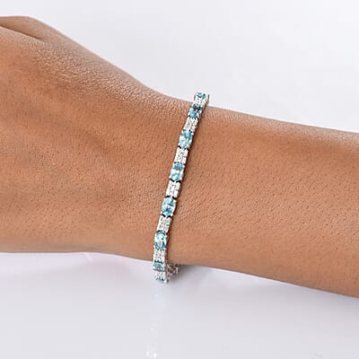 D'Joy Premium Cambodian Blue Zircon and Moissanite 12.85 ctw Floral Blue Vines Bracelet in Rhodium Over Sterling Silver (6.50 In)