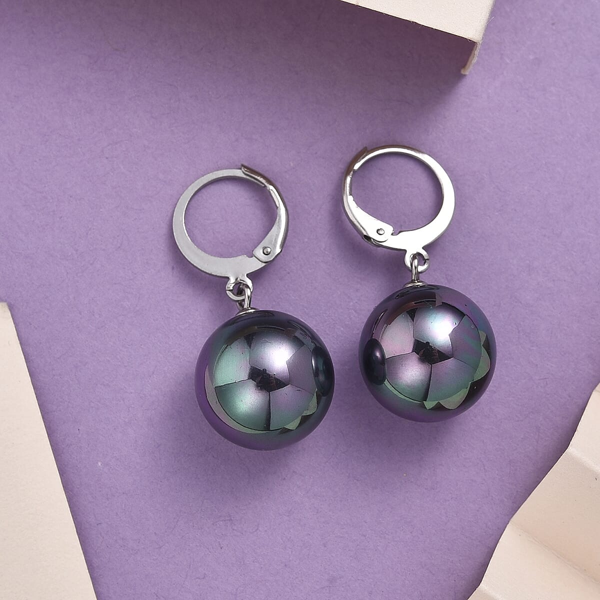 Peacock Color Shell Pearl Dangling Earrings in Stainless Steel image number 1