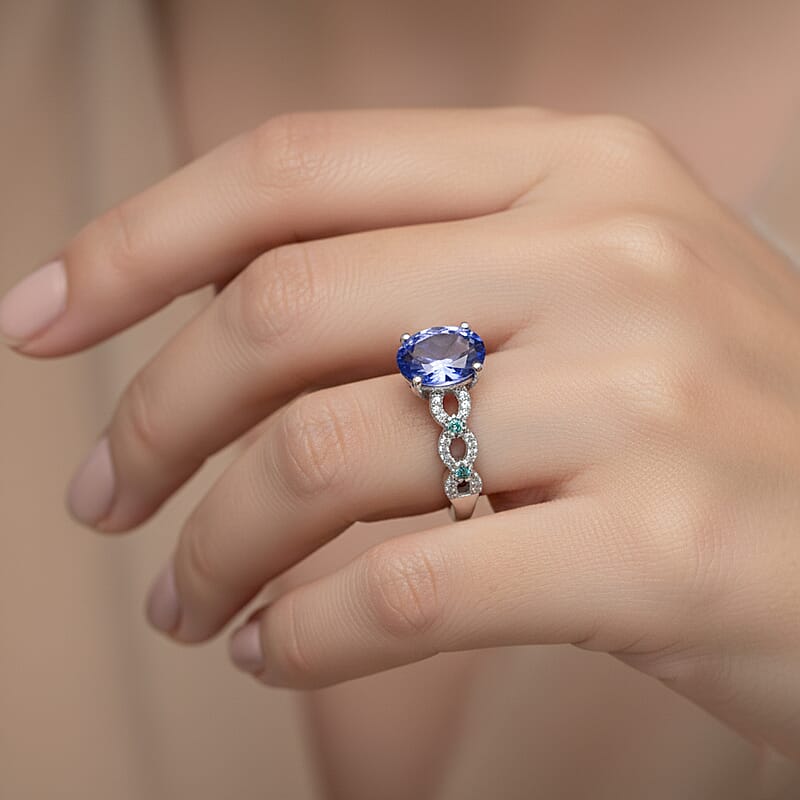 D'Joy Premium Tanzanite, Paraiba Tourmaline and Diamond 1.50 ctw Royal Infinity Ring in Rhodium Over Sterling Silver (Size 6.0)