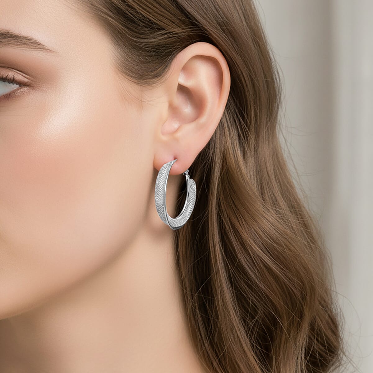 Austrian Crystal Twisted Rope Hoop Earrings in Silvertone image number 2