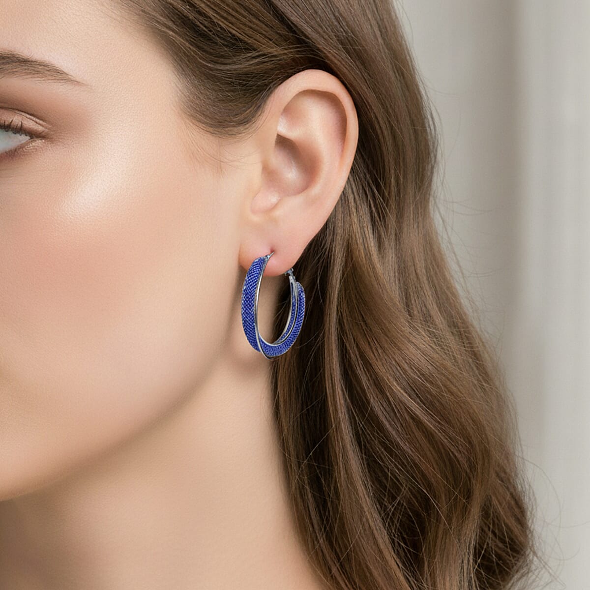 Blue Austrian Crystal Twisted Rope Hoop Earrings in Silvertone image number 2