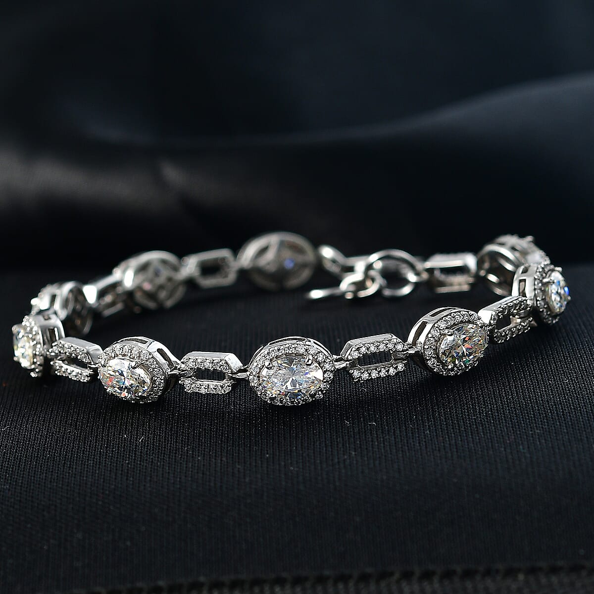 D'Joy Strontium Titanate and Moissanite 7.15 ctw Oval Symphony Bracelet in Rhodium Over Sterling Silver (6.50 In) image number 1