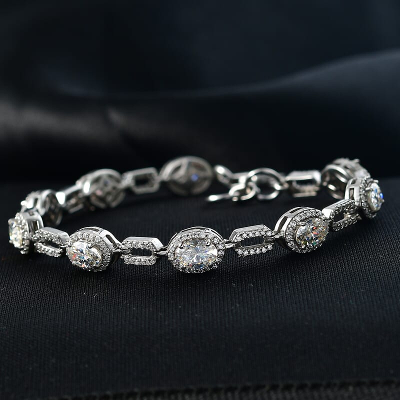 D'Joy Strontium Titanate and Moissanite 7.15 ctw Oval Symphony Bracelet in Rhodium Over Sterling Silver (6.50 In)