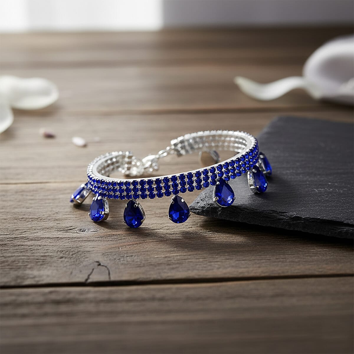 Sparkling Blue Austrian Crystal Dripping Bracelet in Silvertone (7.50-9.50In) image number 1