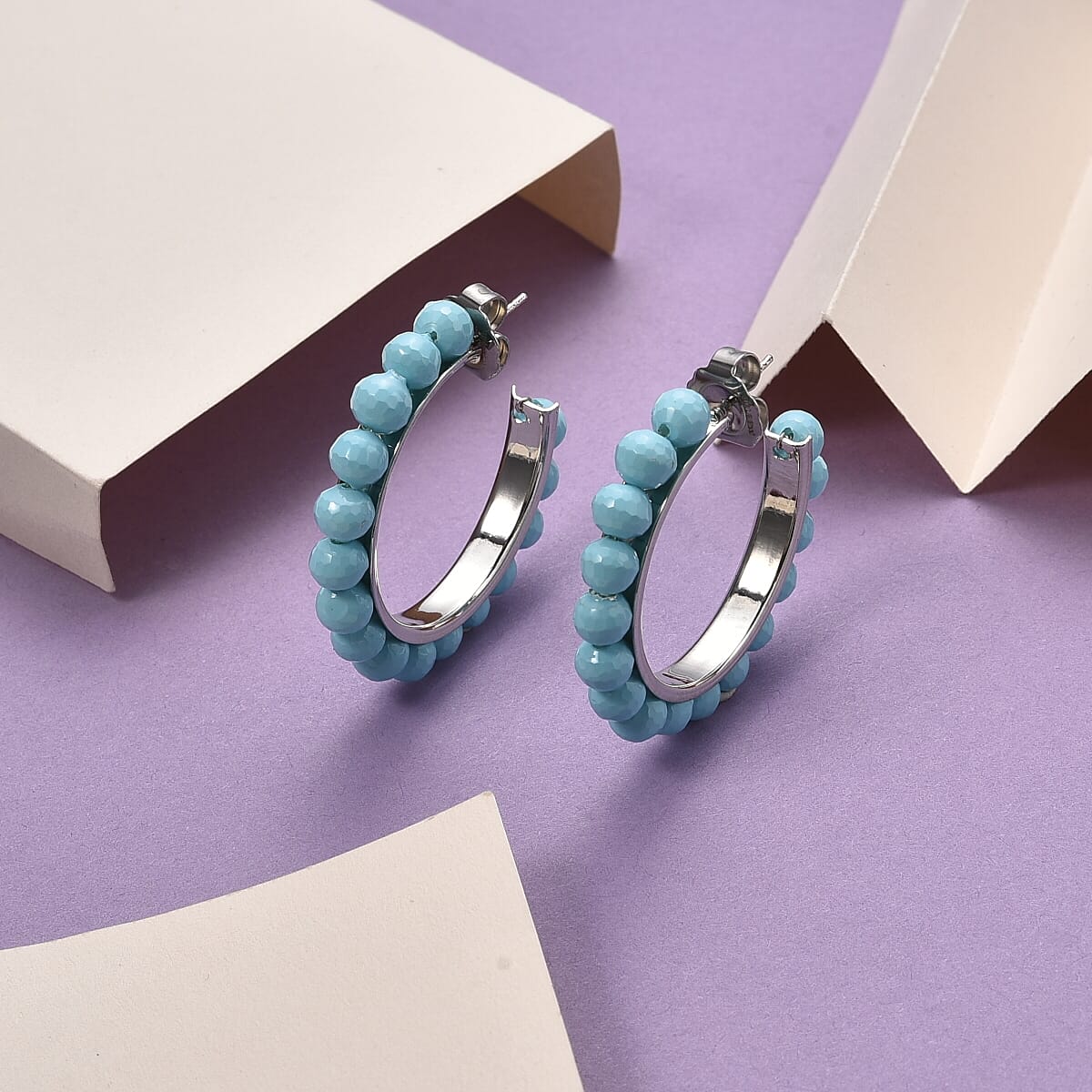 Doorbuster Sleeping Beauty Color Shell Pearl Earrings in Stainless Steel image number 1