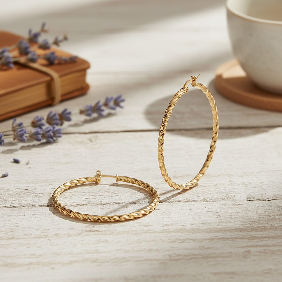 Twisted Hoop Earrings in ION Plated YG Stainless Steel image number 1