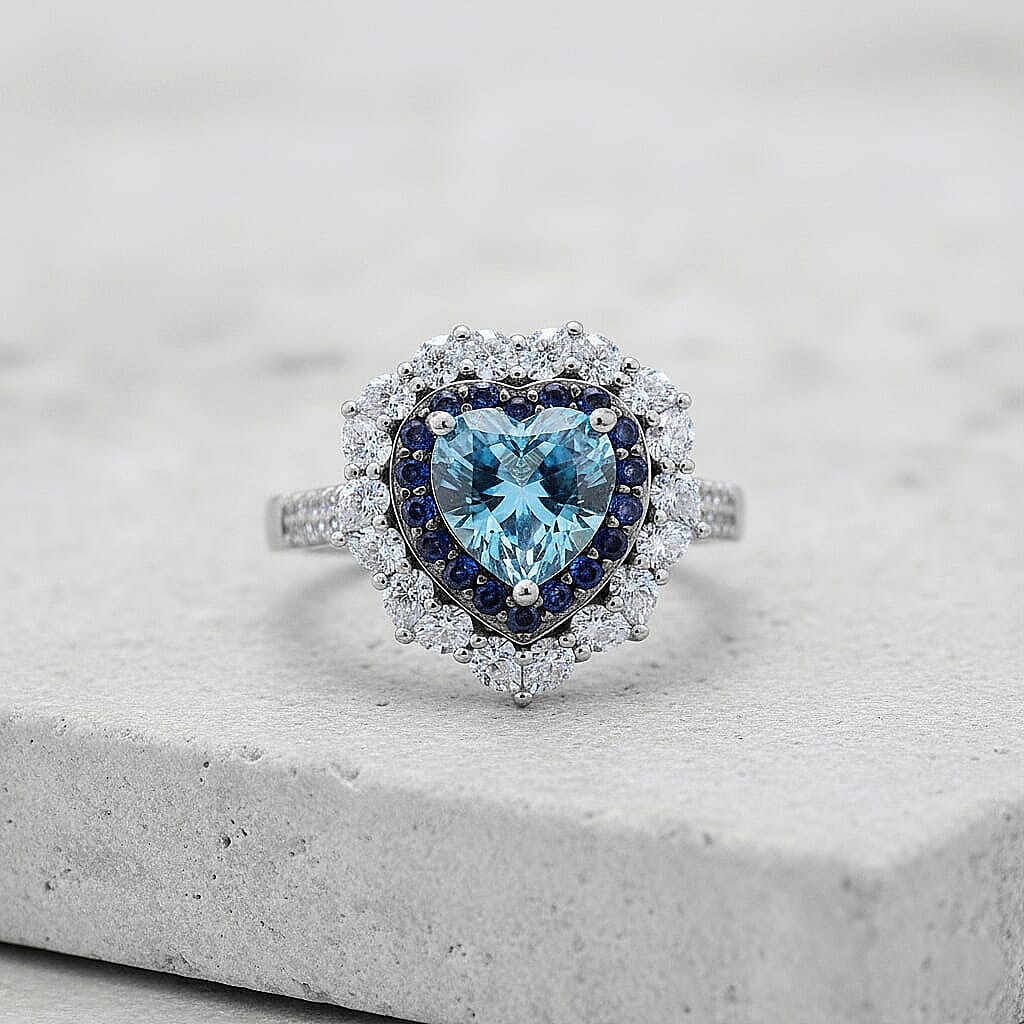  D'Joy Blue and White Moissanite and Blue Sapphire 3.10 ctw Crowned Heart Glow Ring in Rhodium Over Sterling Silver (Size 10.0)