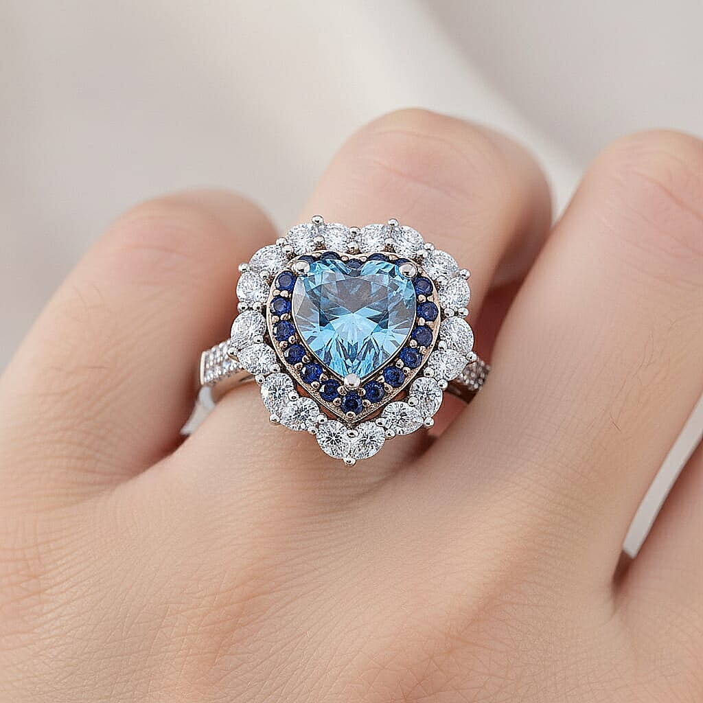  D'Joy Blue and White Moissanite and Blue Sapphire 3.10 ctw Crowned Heart Glow Ring in Rhodium Over Sterling Silver (Size 10.0)