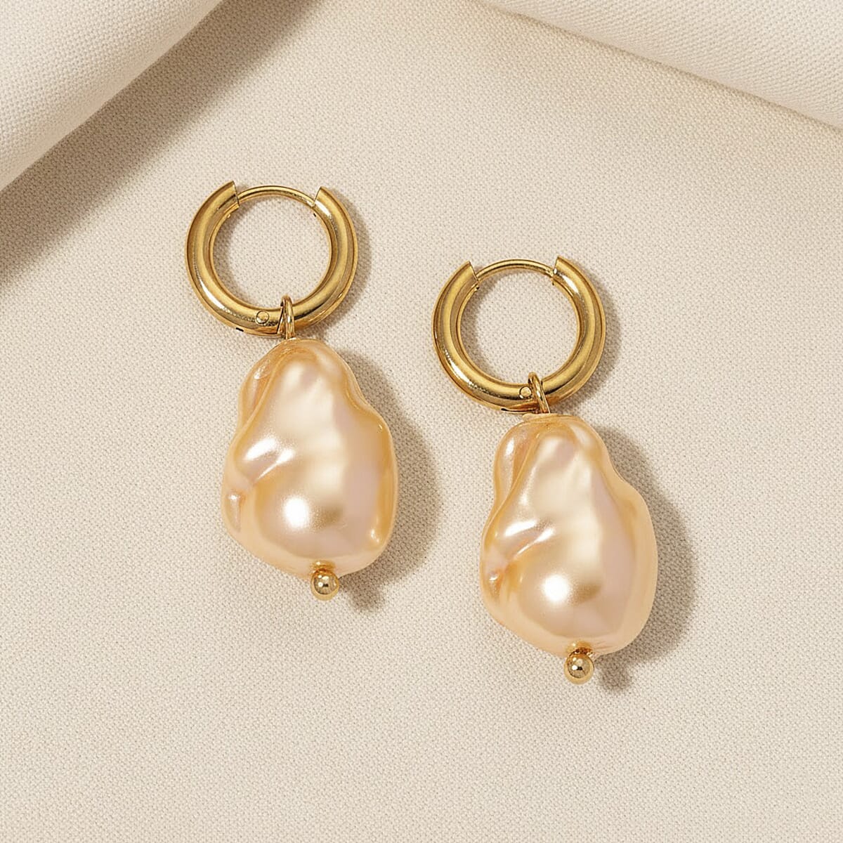 Golden Shell Pearl Earrings in ION Plated YG Stainless Steel image number 1