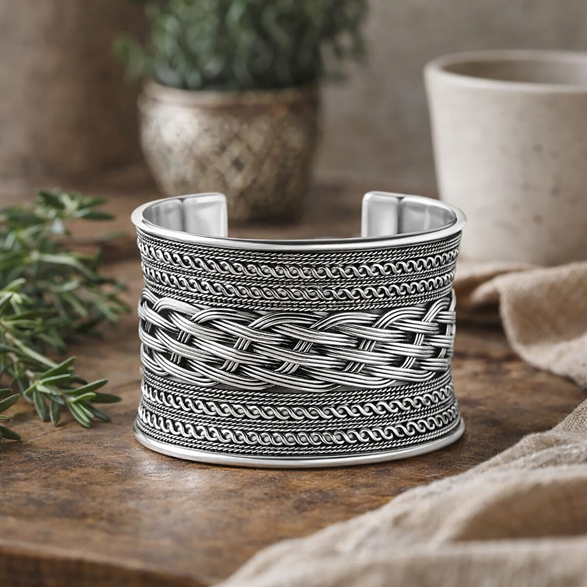 Handmade Braided Cuff Bracelet in Silvertone image number 1