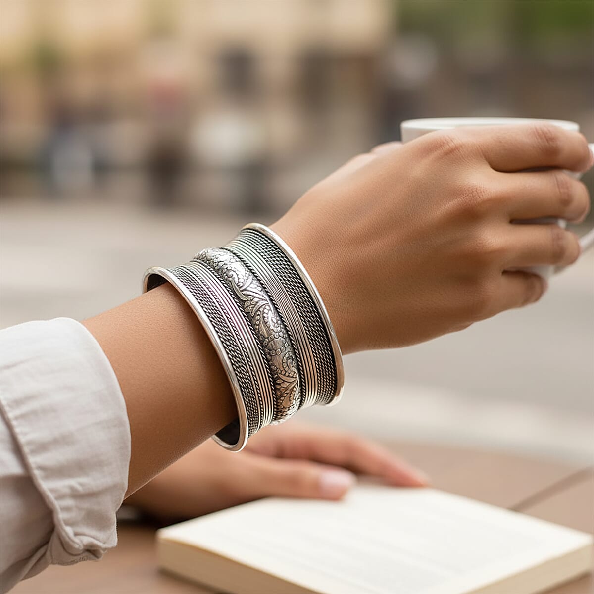 Handmade Braided Cuff Bracelet in Silvertone image number 1