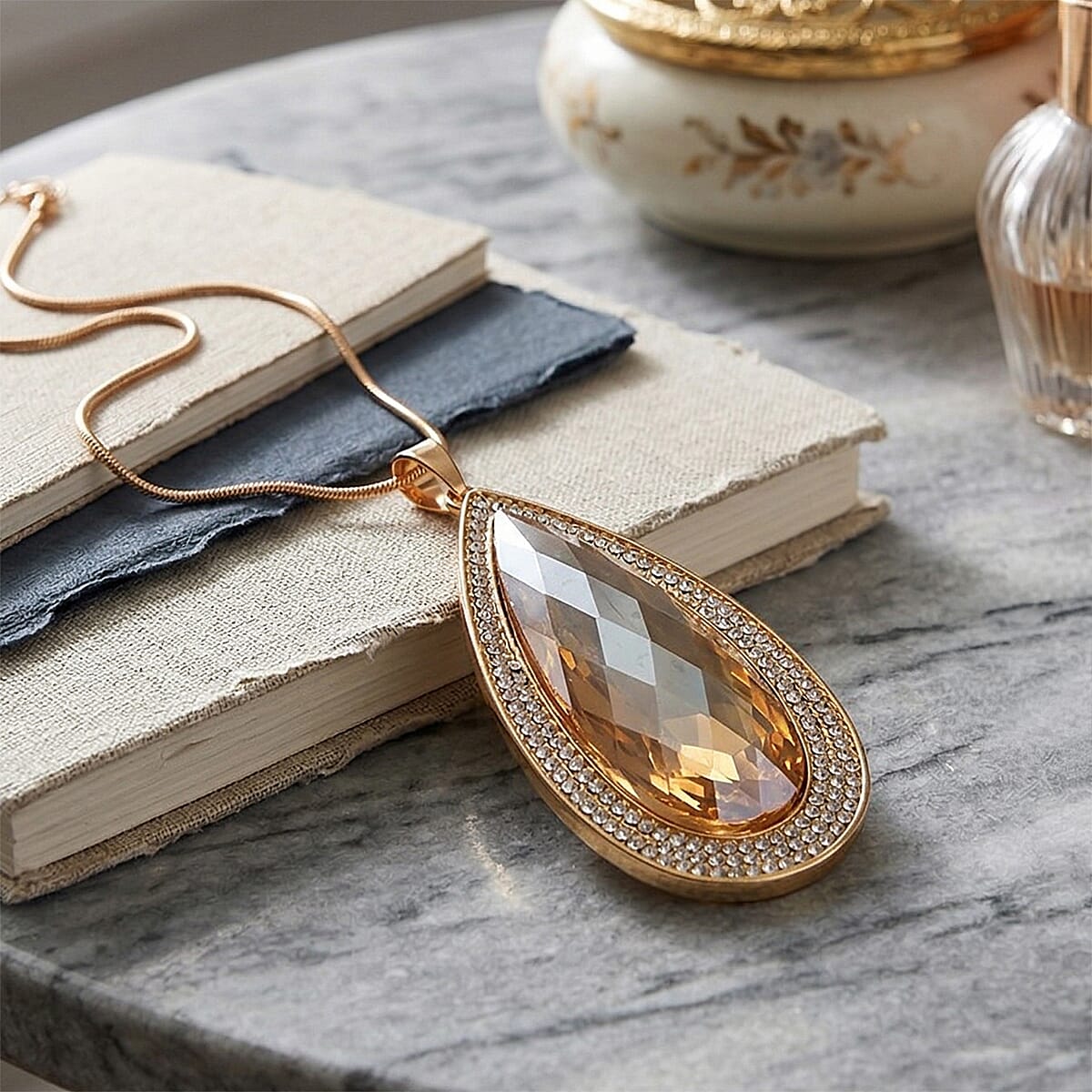 Simulated Champagne Sapphire and Austrian Crystal Elongated Pendant Necklace in Goldtone 24-26 Inches image number 1