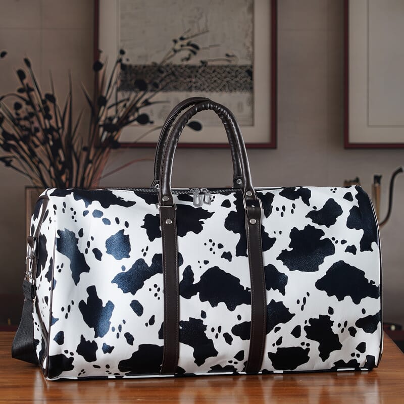 La Marey Black and White Cow Pattern Faux Leather Duffel Bag
