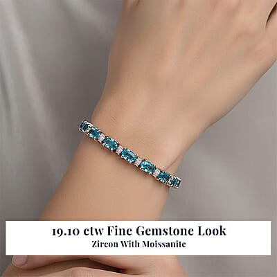 D'Joy Premium Cambodian Blue Zircon and Moissanite 19.10 ctw Ocean Glow Bracelet in Rhodium Over Sterling Silve (6.50 In)
