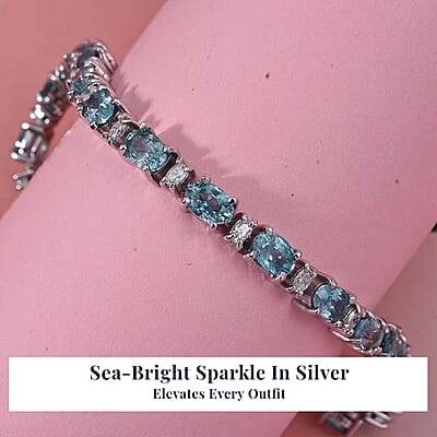 D'Joy Premium Cambodian Blue Zircon and Moissanite 19.10 ctw Ocean Glow Bracelet in Rhodium Over Sterling Silve (6.50 In)
