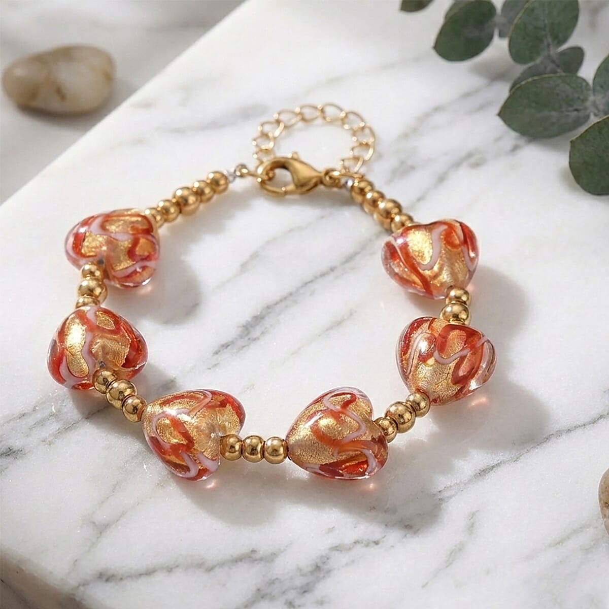 Green Murano Style Heart Bracelet in ION Plated YG Stainless Steel (7.00-8.5In) image number 1