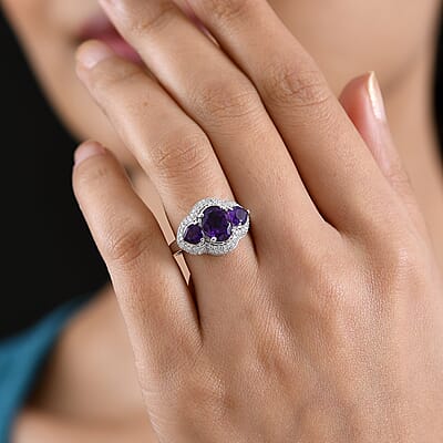 D'Joy Premium Lusaka Amethyst and Moissanite 3.00 ctw Trilogy Ring in Rhodium Over Sterling Silver (Size 7.0)
