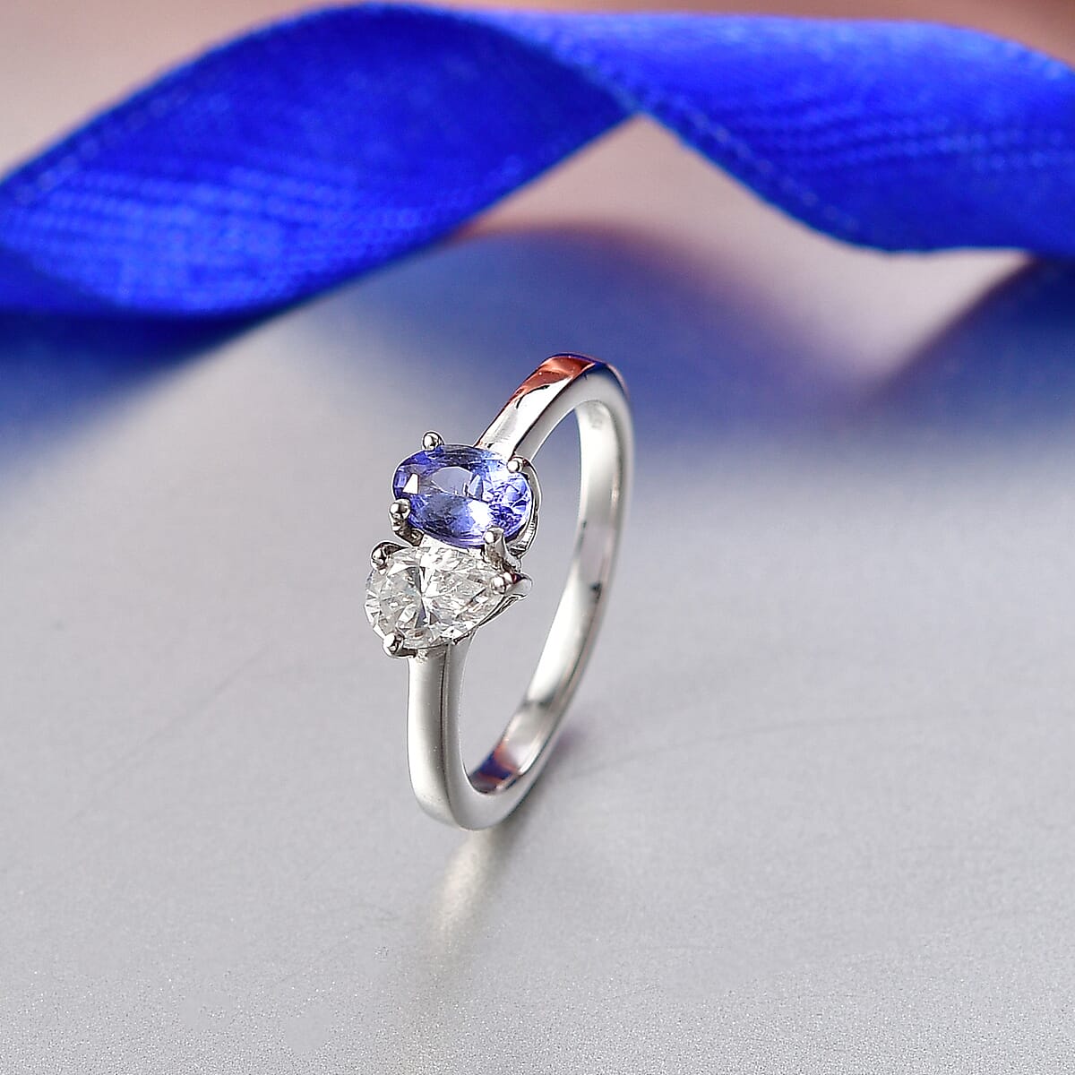 D'Joy Tanzanite and Moissanite 0.80 ctw Toi et Moi Ring in Rhodium Over Sterling Silver (Size 7.0) image number 1