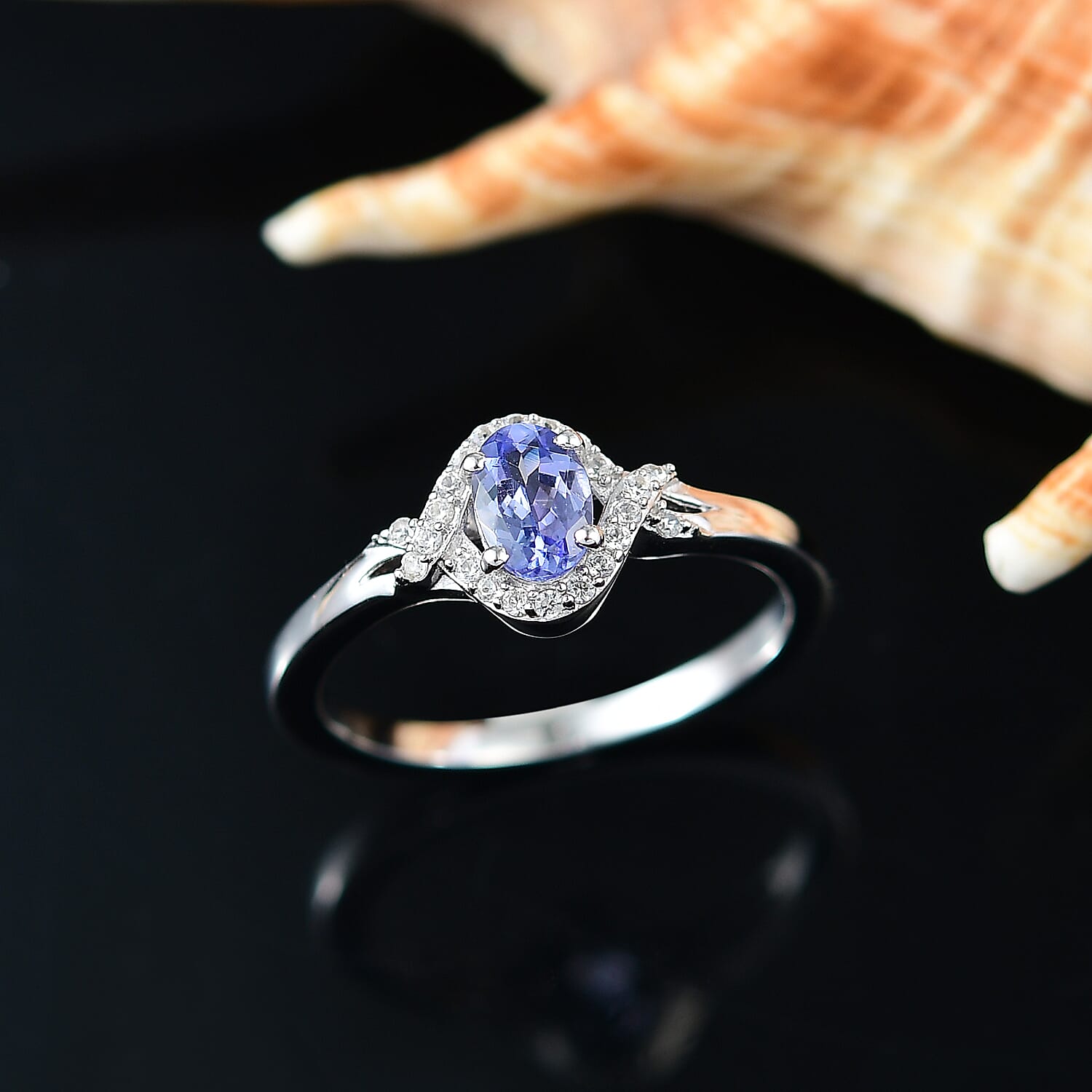 Tanzanite and White Zircon 0.65 ctw Ring in Rhodium Over Sterling Silver (Size 8.0)