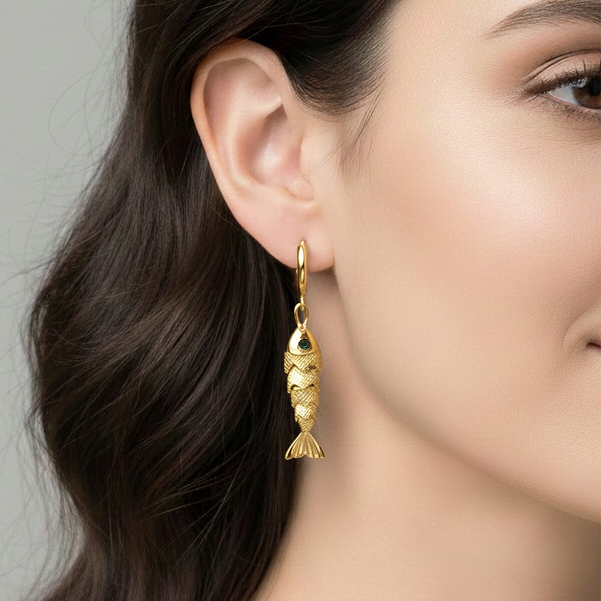 Simulated Green Diamond Fish Earrings in Goldtone image number 2