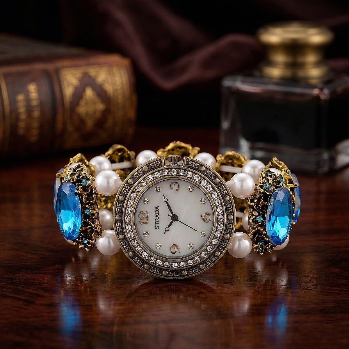 Strada Blue Glass and White Resin Pearl SL68 Quartz Movement Stretch Bracelet Watch in Goldtone image number 1