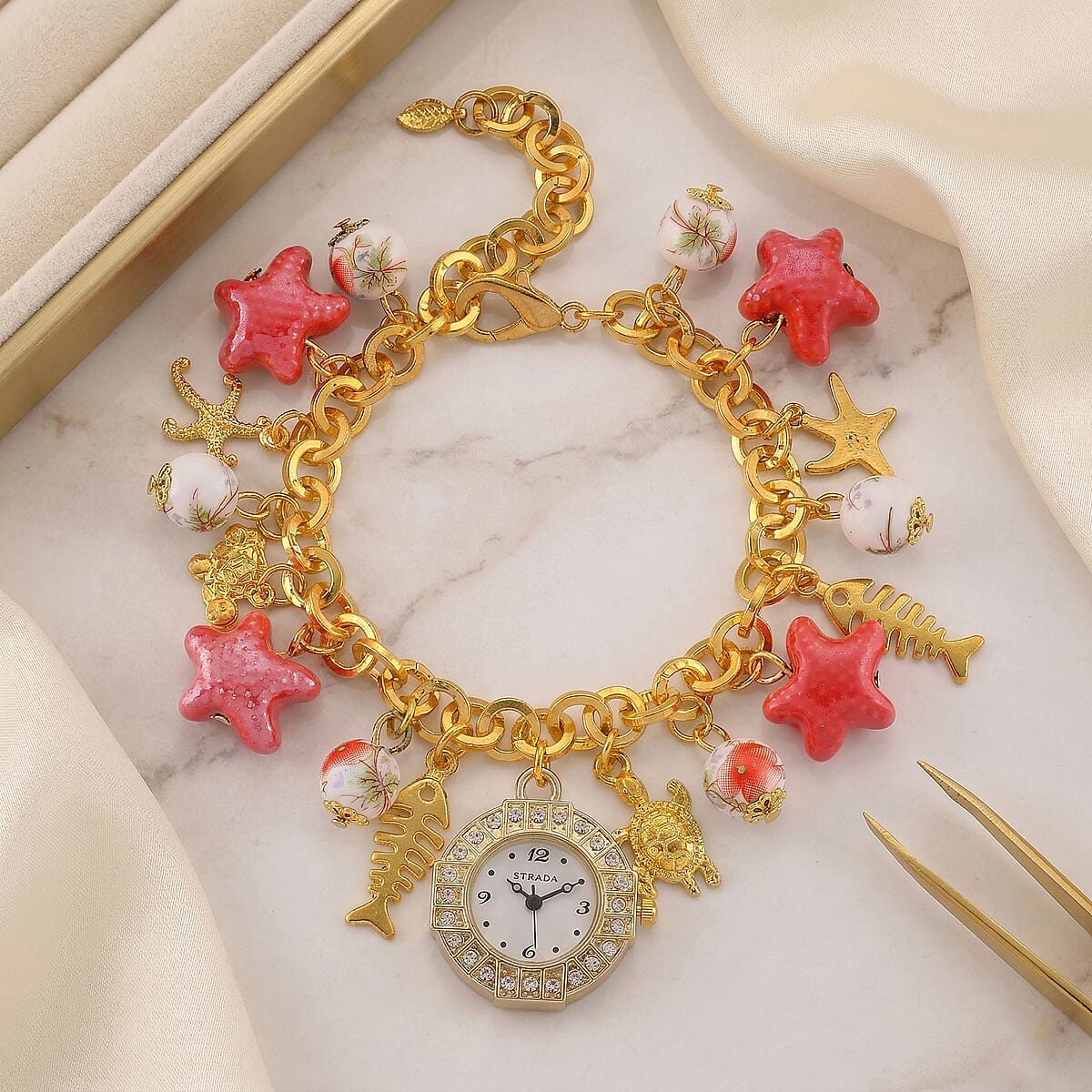 Strada SL68 Quartz Movement Stretch Bracelet Watch Red Ceramic Beads and Star, Charms in Goldtone image number 1