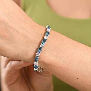 D'Joy Certified London Blue Topaz and Moissanite 17.10 ctw Bracelet in Rhodium Over Sterling Silver (6.50 In)