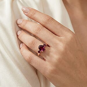 D'Joy Premium Orissa Rhodolite Garnet and Moissanite 1.80 ctw 3 Stone Ring in 18K Vermeil Rose Gold Over Sterling Silver (Size 10.0)