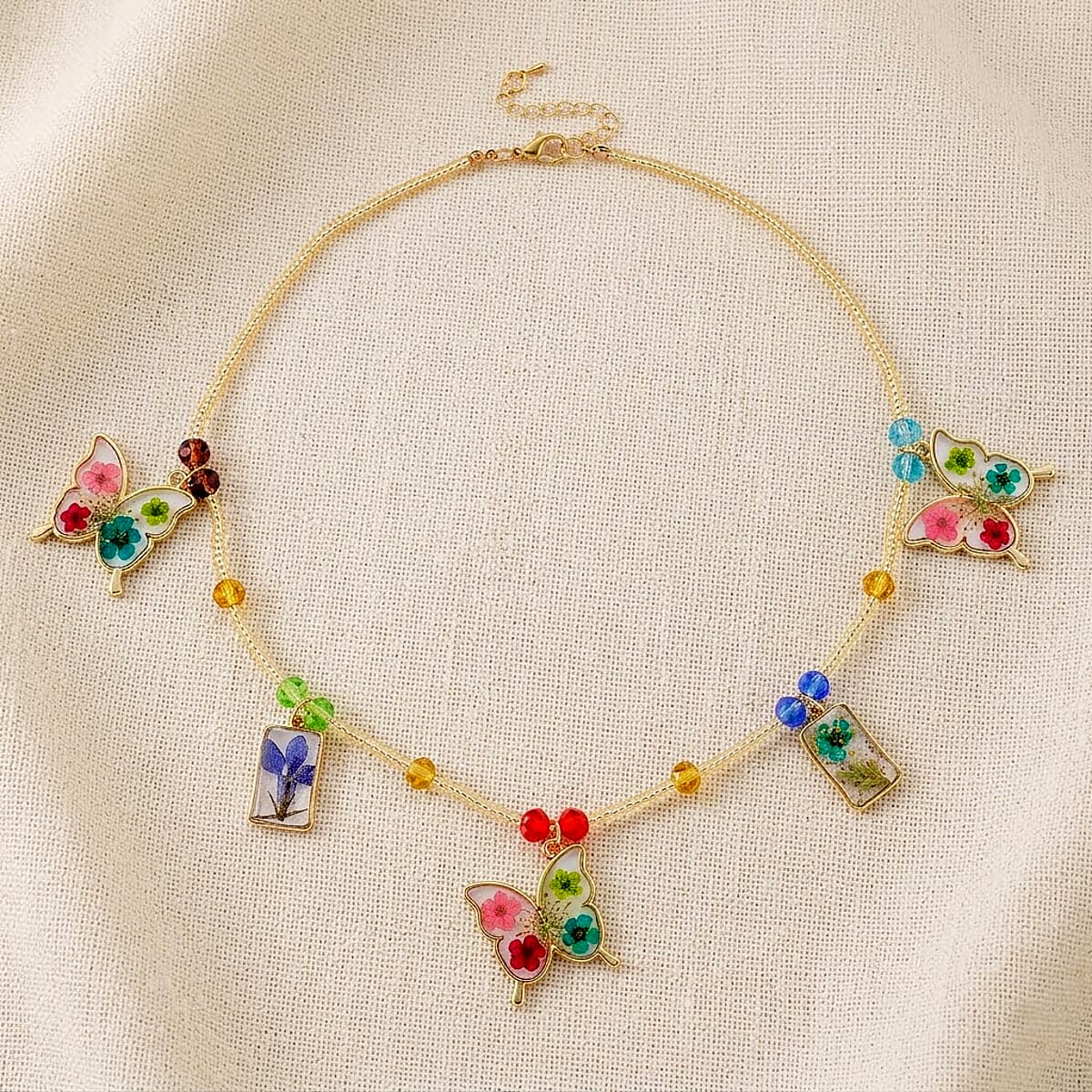Resin, Multi Color Glass Necklace with Dry Flowers Filled Butterfly Charms in Goldtone (20-22Inches) image number 1
