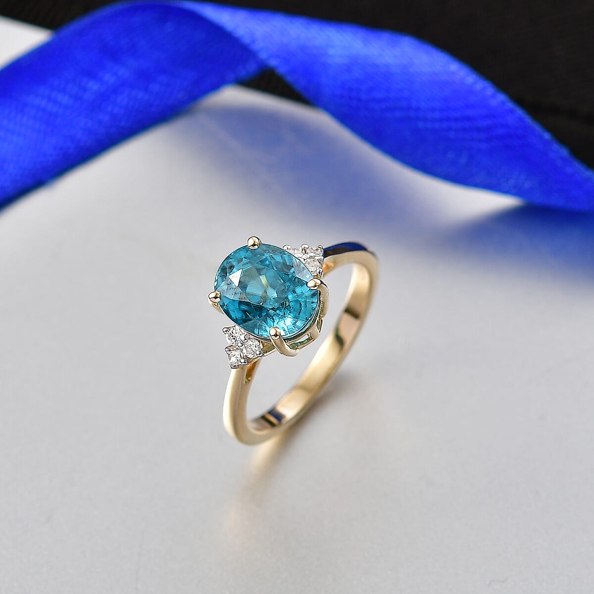 Luxoro AAAA Cambodian Blue Zircon and Diamond I2 4.75 ctw Ocean Light Ring in 10K Yellow Gold (Size 8.0) image number 1