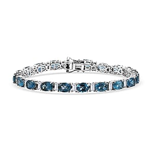 D'Joy London Blue Topaz and Moissanite 20.75 ctw Midnight Blue Tennis Bracelet in Rhodium Over Sterling Silver (7.25 In)