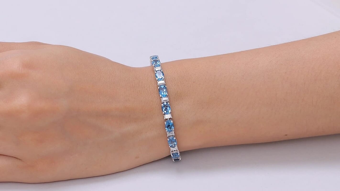 D'Joy London Blue Topaz and Moissanite 20.75 ctw Ocean Rhythm Line Bracelet in Rhodium Over Sterling Silver (7.25 In)