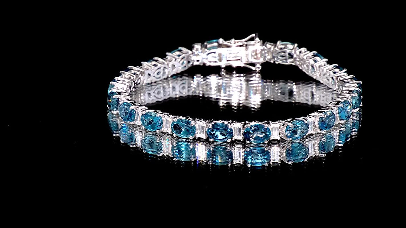 D'Joy London Blue Topaz and Moissanite 20.75 ctw Ocean Rhythm Line Bracelet in Rhodium Over Sterling Silver (7.25 In)