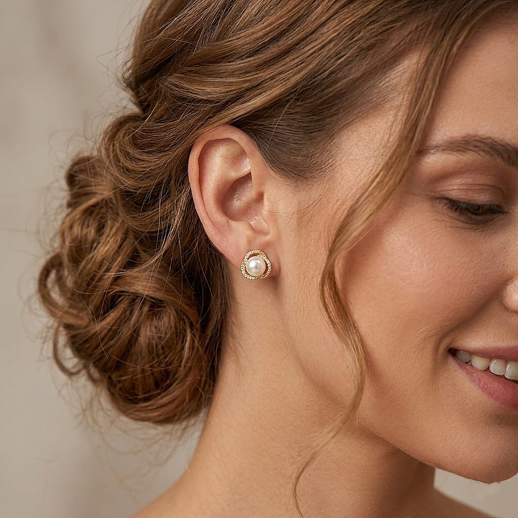 White Shell Pearl and Simulated Diamond 0.20 ctw Earrings in Goldtone