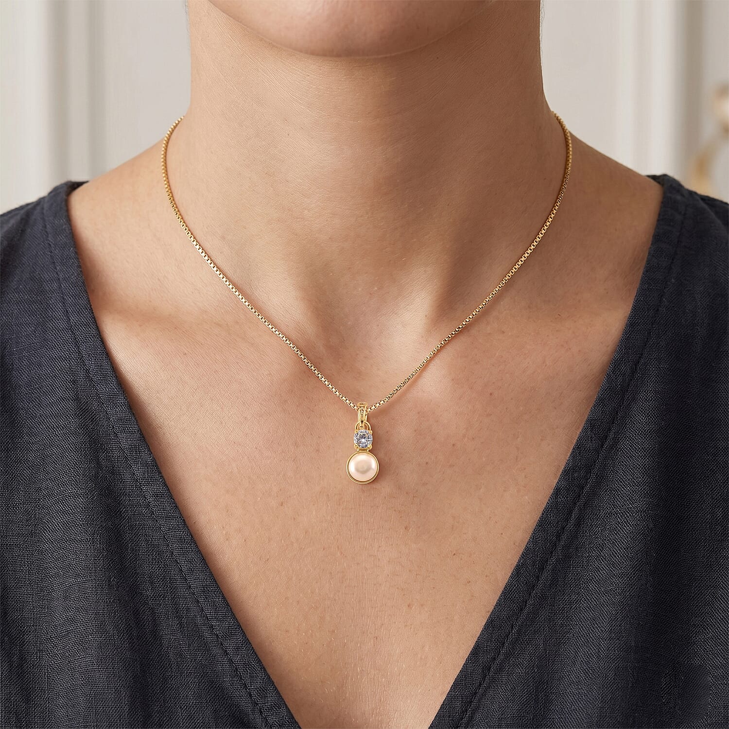 White Shell Pearl and Simulated Diamond 0.05 ctw Necklace in Goldtone 18-20 Inches