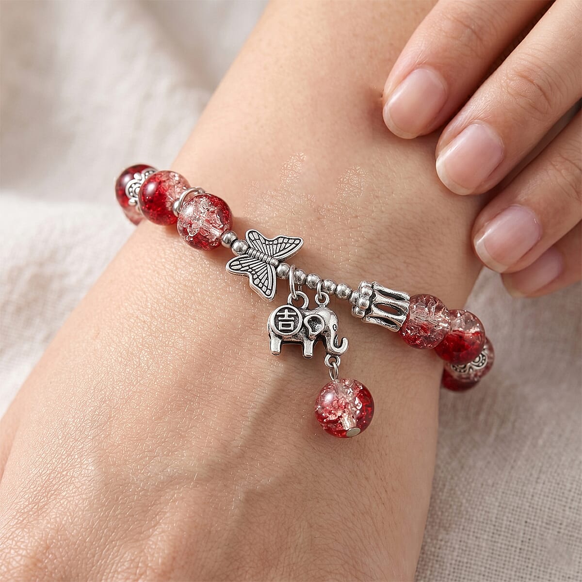 Red Glass Beaded Stretch Bracelet with Butterfly and Elephant Charm in Silvertone image number 2