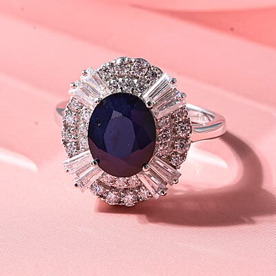 D'Joy Kanchanaburi Blue Sapphire (DF) and Moissanite 4.30 ctw Royal Night Halo Ring in Rhodium Over Sterling Silver (Size 6.0)