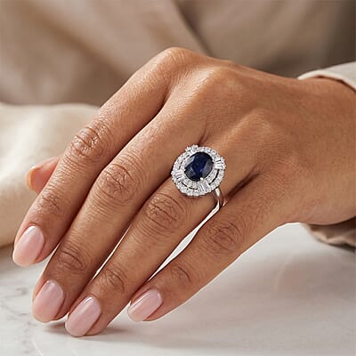 D'Joy Kanchanaburi Blue Sapphire (DF) and Moissanite 4.30 ctw Royal Night Halo Ring in Rhodium Over Sterling Silver (Size 6.0)