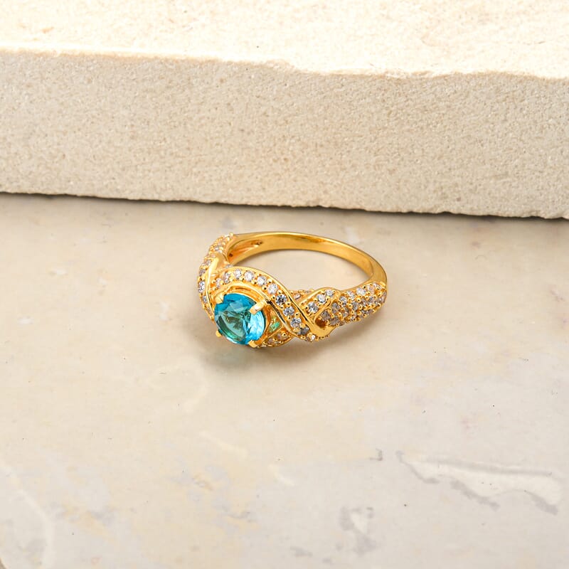 Blue Topaz and Simulated Diamond 1.65 ctw Ring in 14K YG Over Sterling Silver (Size 7.0)