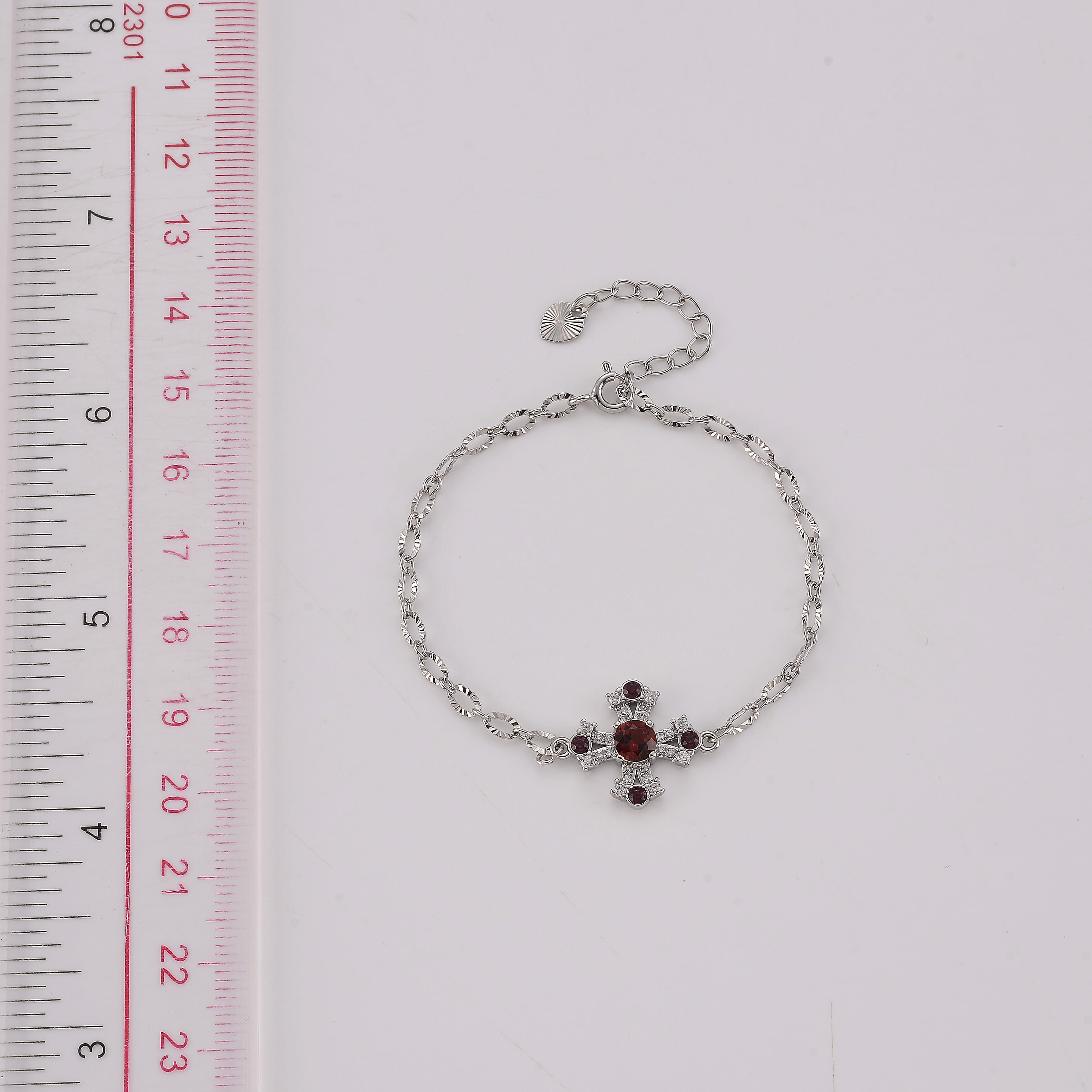 Mozambique Garnet and Simulated Diamond 0.68 ctw Bracelet in Silvertone (6-7In)