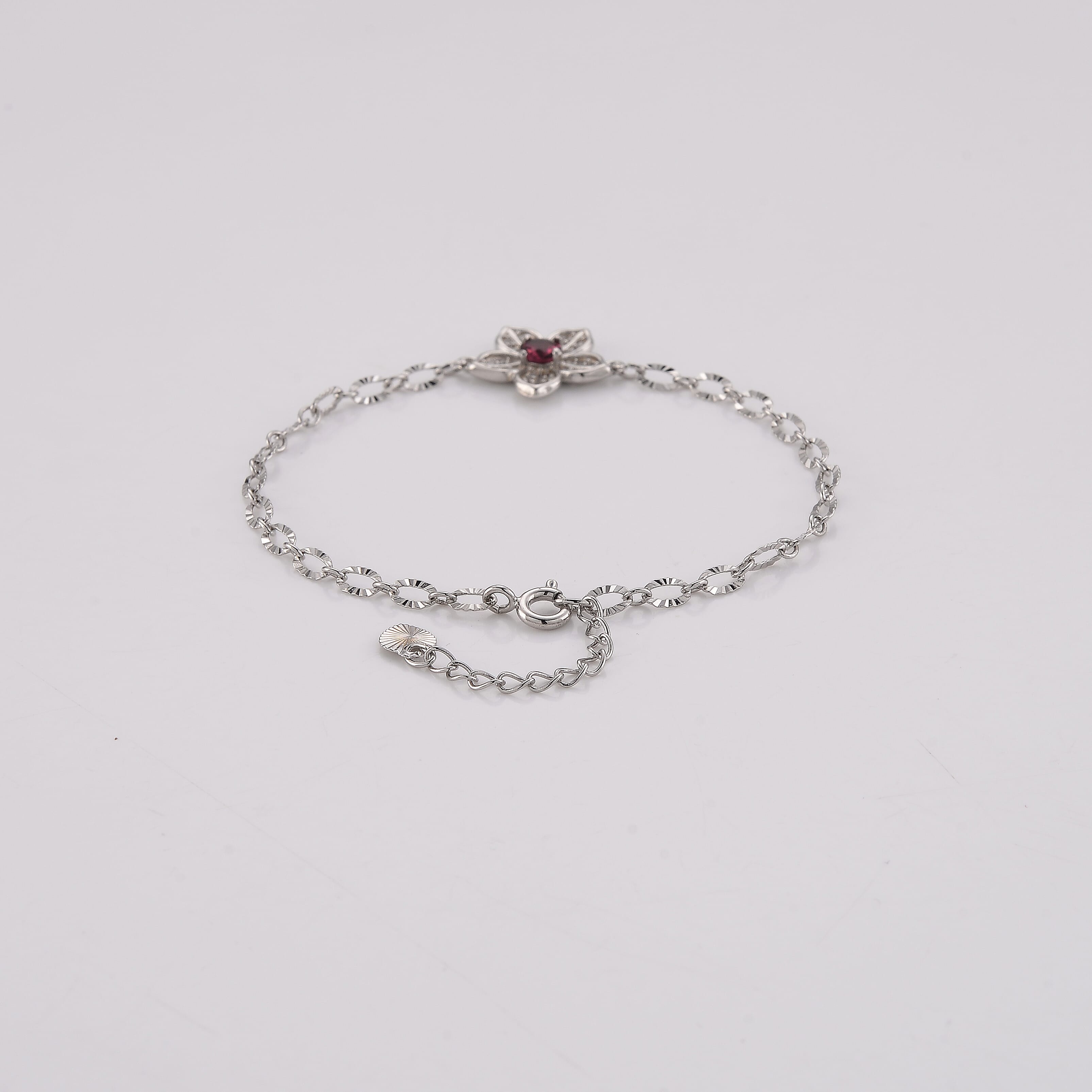 Mozambique Garnet and Simulated Diamond 0.30 ctw Bracelet in Silvertone (6-7In)