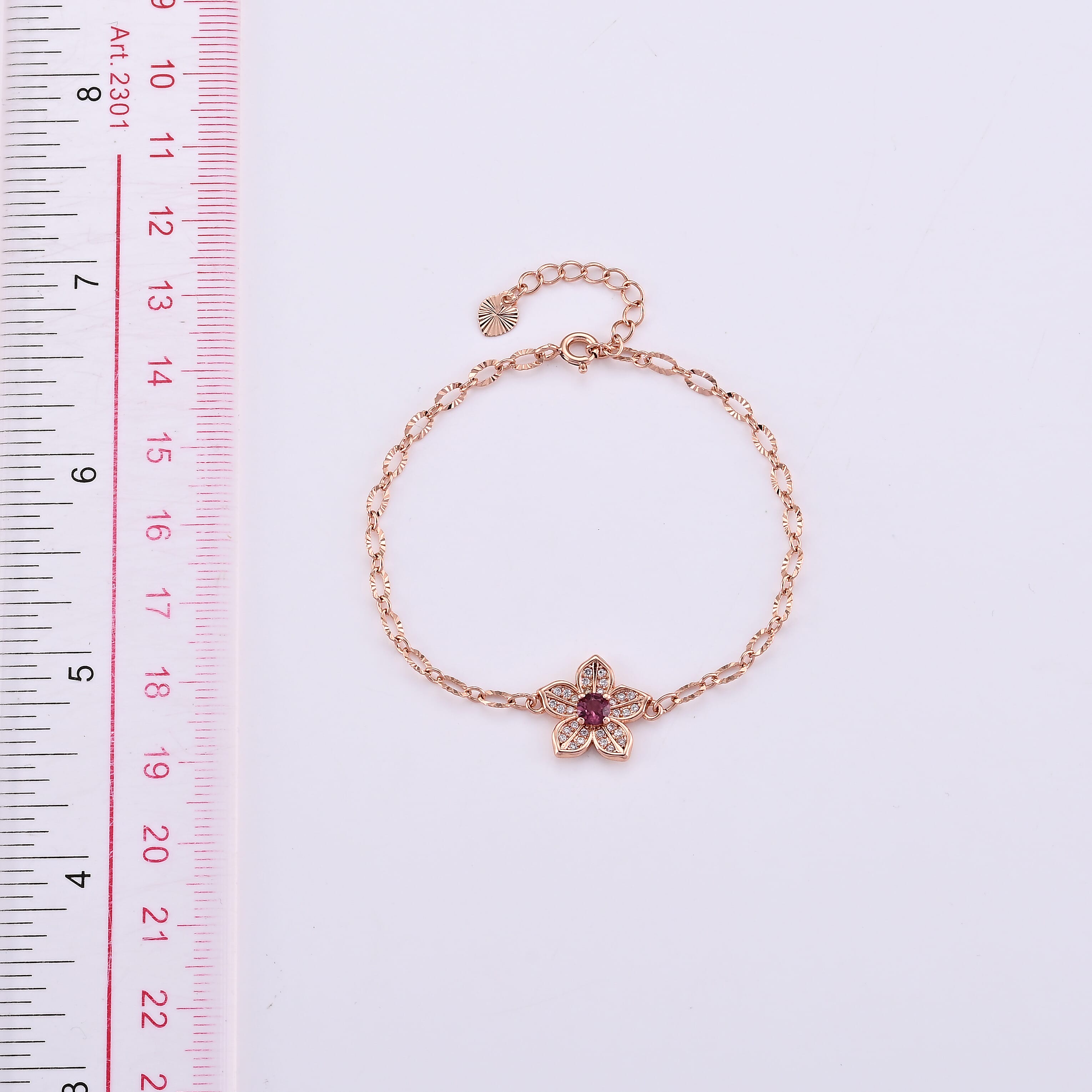 Mozambique Garnet and Simulated Diamond Bracelet in Rosetone (6-7In) 0.30 ctw