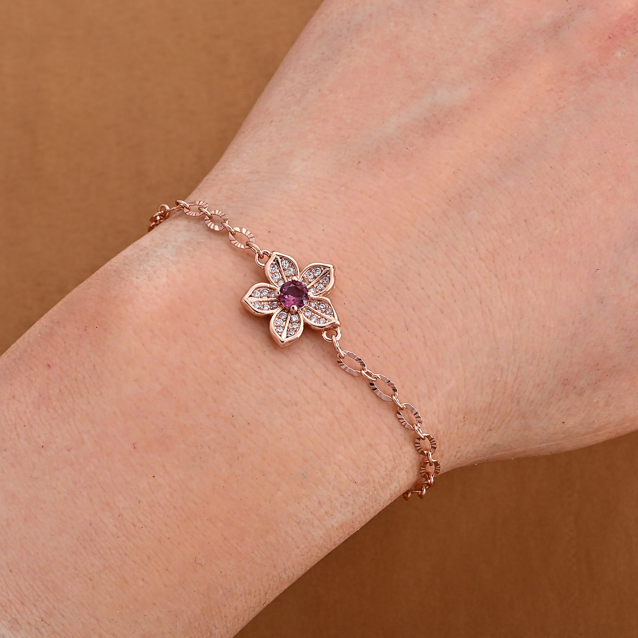Mozambique Garnet and Simulated Diamond Bracelet in Rosetone (6-7In) 0.30 ctw