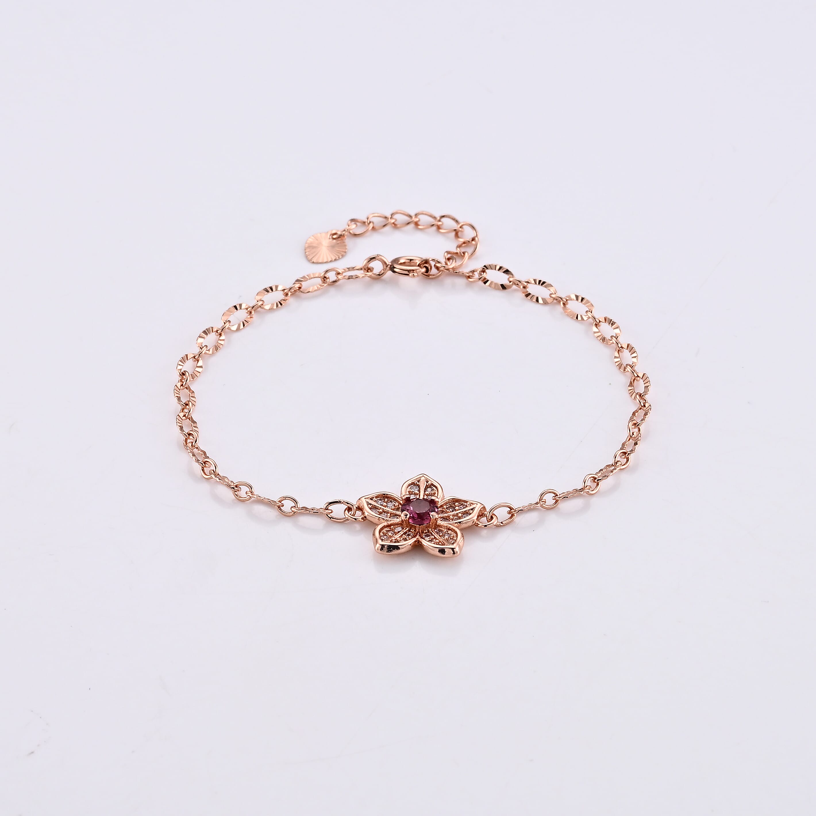 Mozambique Garnet and Simulated Diamond Bracelet in Rosetone (6-7In) 0.30 ctw