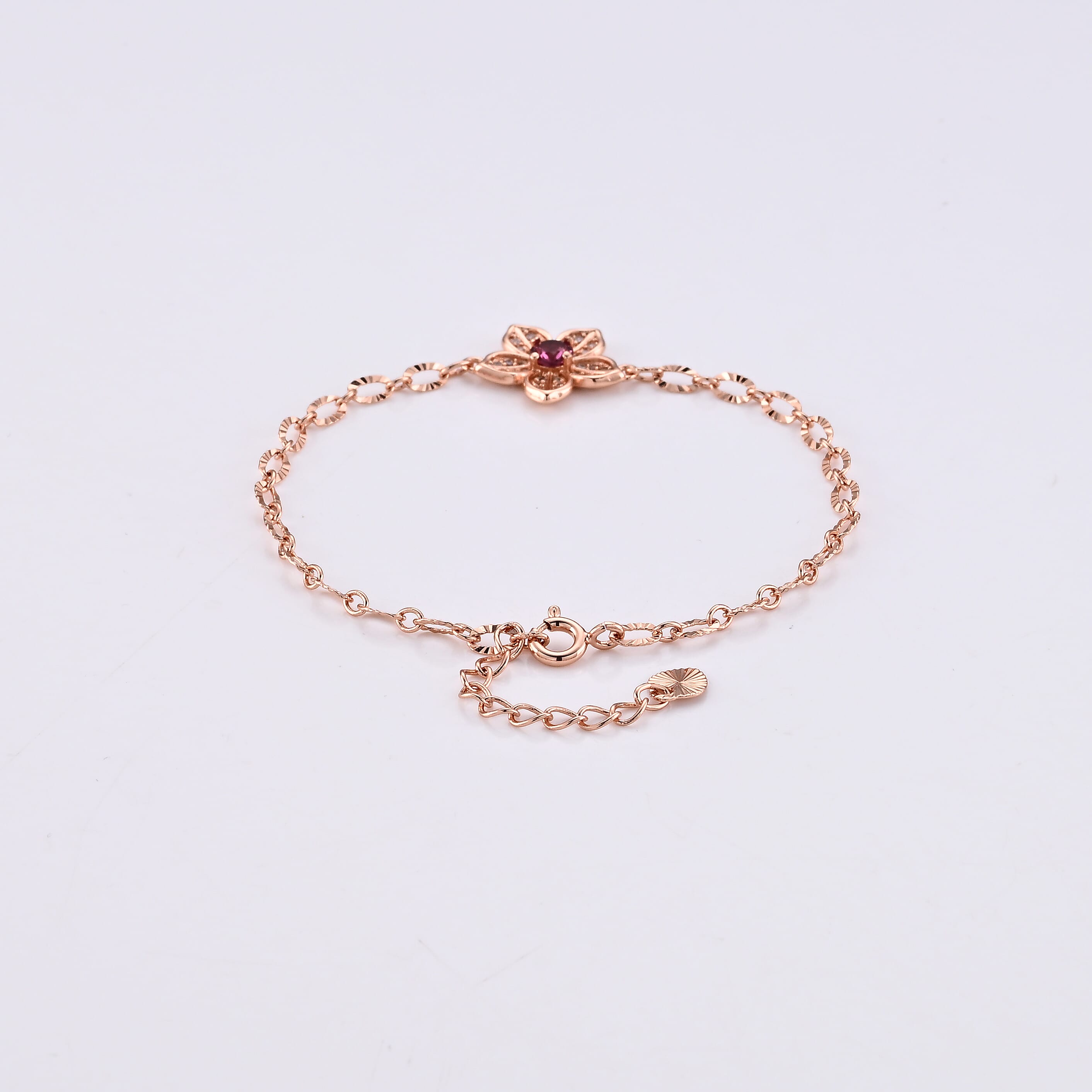 Mozambique Garnet and Simulated Diamond Bracelet in Rosetone (6-7In) 0.30 ctw