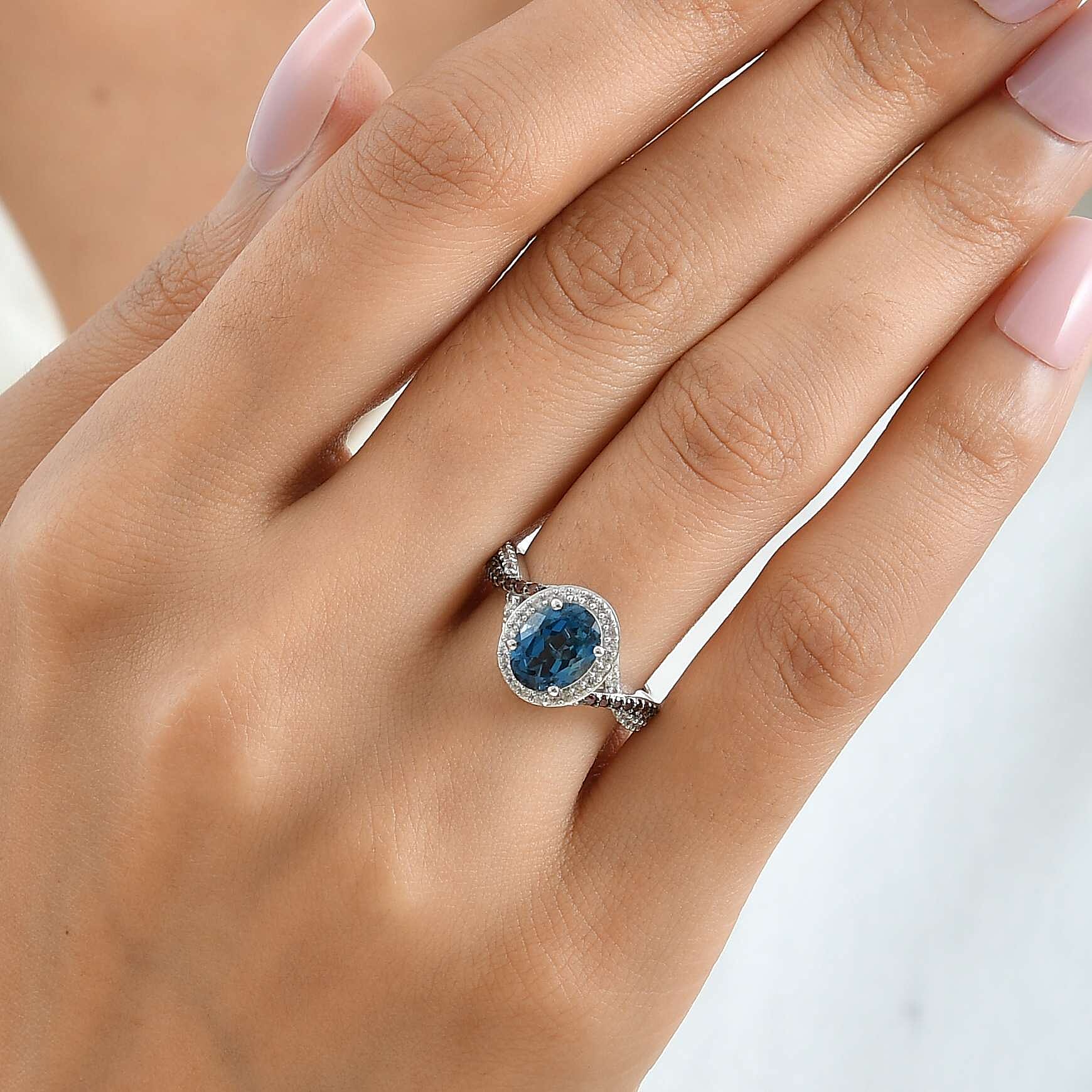 D'Joy London Blue Topaz, Brown and White Zircon 2.85 ctw Blue Infinity Ring in Rhodium Over Sterling Silver (Size 8.0)