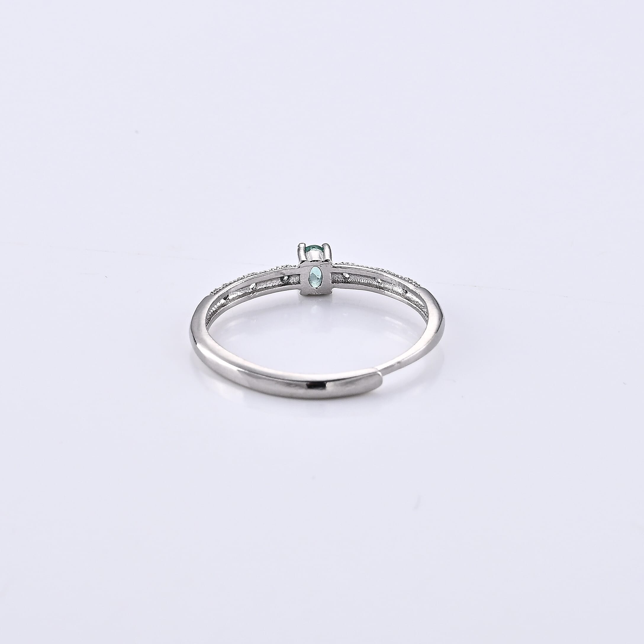Emerald and Simulated Diamond 0.33 ctw Ring in Silvertone (Adjustable)
