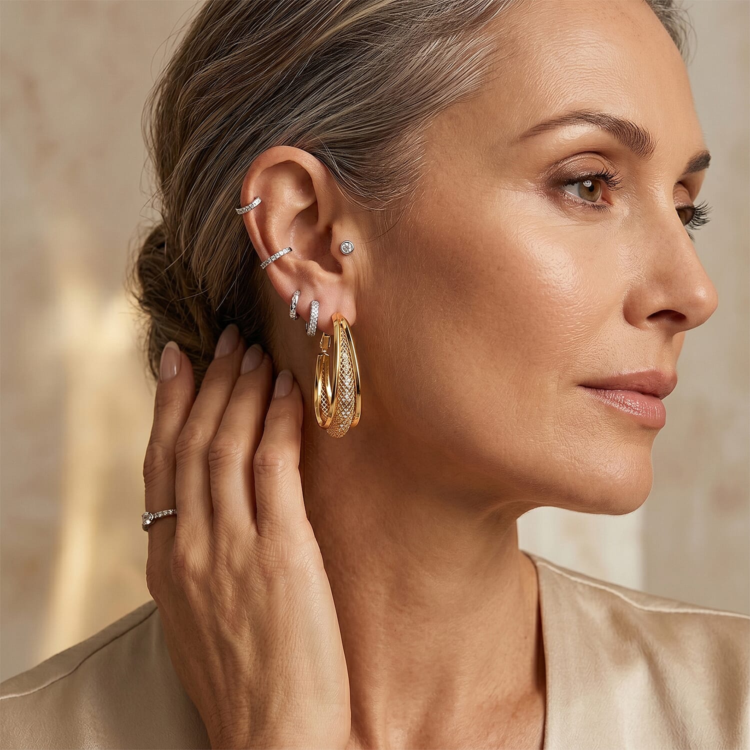 Simulated Diamond Sculpted Hoop Earring in Goldtone