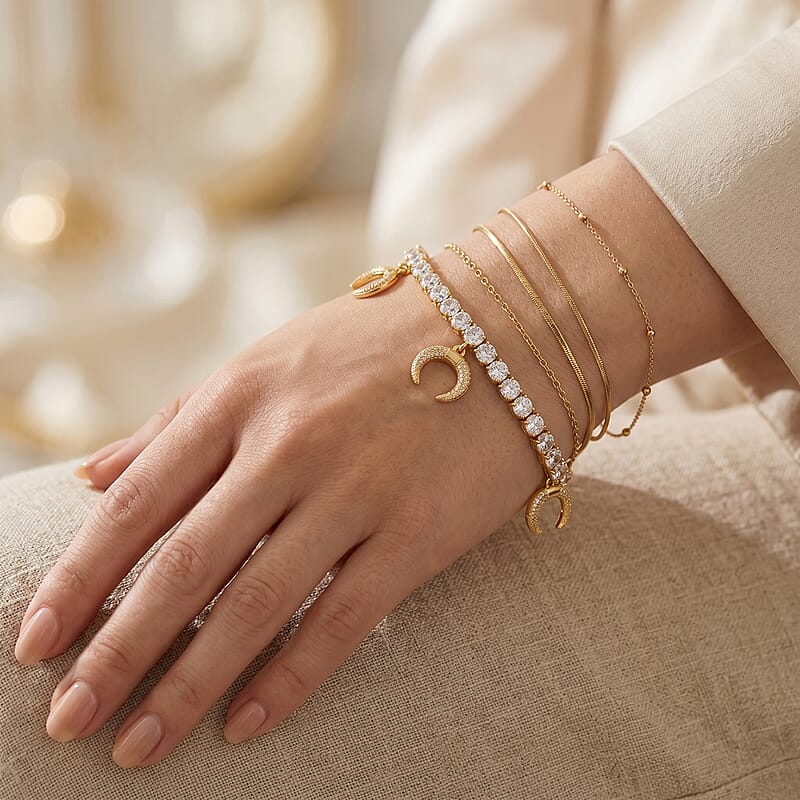 Simulated Diamond Tennis Bracelet with Crescent Moon Charms in Goldtone (7.00 In)