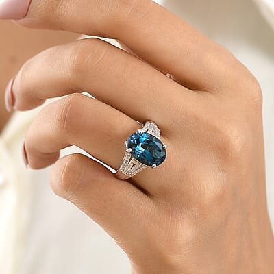 D'Joy London Blue Topaz and Moissanite 7.40 ctw Ocean Citadel Ring in Rhodium Over Sterling Silver (Size 6.0)